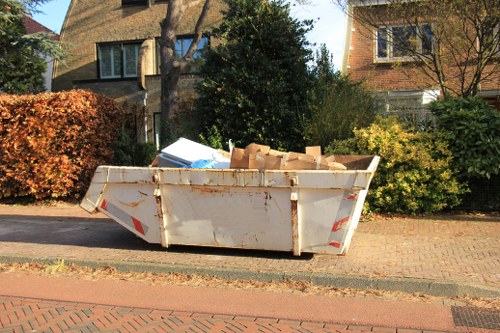Bulk waste collection truck outside a Poplar home